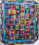 multi colored geometric pattern quilt 