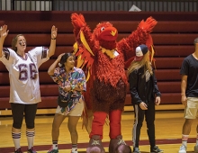 The phoenix mascot cheers on the crowd