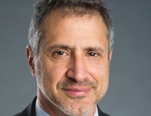 A portrait of Gustavo Schewd ’84 in a head shot.