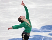 Jason Brown strikes a dramatic pose during day two of the Sochi 2014 Winter Olympics, wearing the pants Jo Lynne Johnson ’72 tailored.