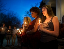 close up of students holding candles