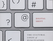 The cover of The Digital Shift featuring punctuation marks on a computer keyboard