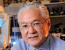 Joseph Takahashi ’74—Public Health Adviser is an older man with glasses and white hair looking at the camera. 