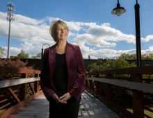 Margaret Nordstrom ’70 stands on a beautiful walkway in nature
