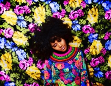 Cecily Bumbray surrounded by colorful flowers