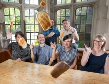 Photo of the Bulletin staff throwing toast at the camera.