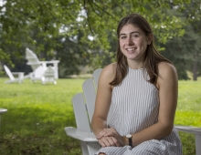 Olivia Leventhal ’18 sitting in an Adirondack chair.