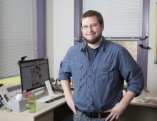 Jonathan Riggs standing in his office
