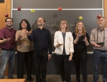 Bulletin staffers tossing apples in a classroom