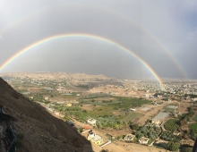 A rainbow over a valley. 