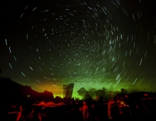 time-progression photo of star-blurred night sky