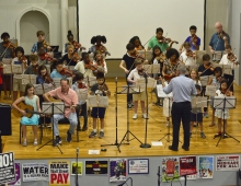 Ken Giles ’71 conducts his student orchestra