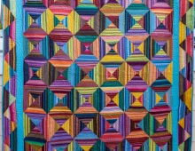 multi colored geometric pattern quilt 