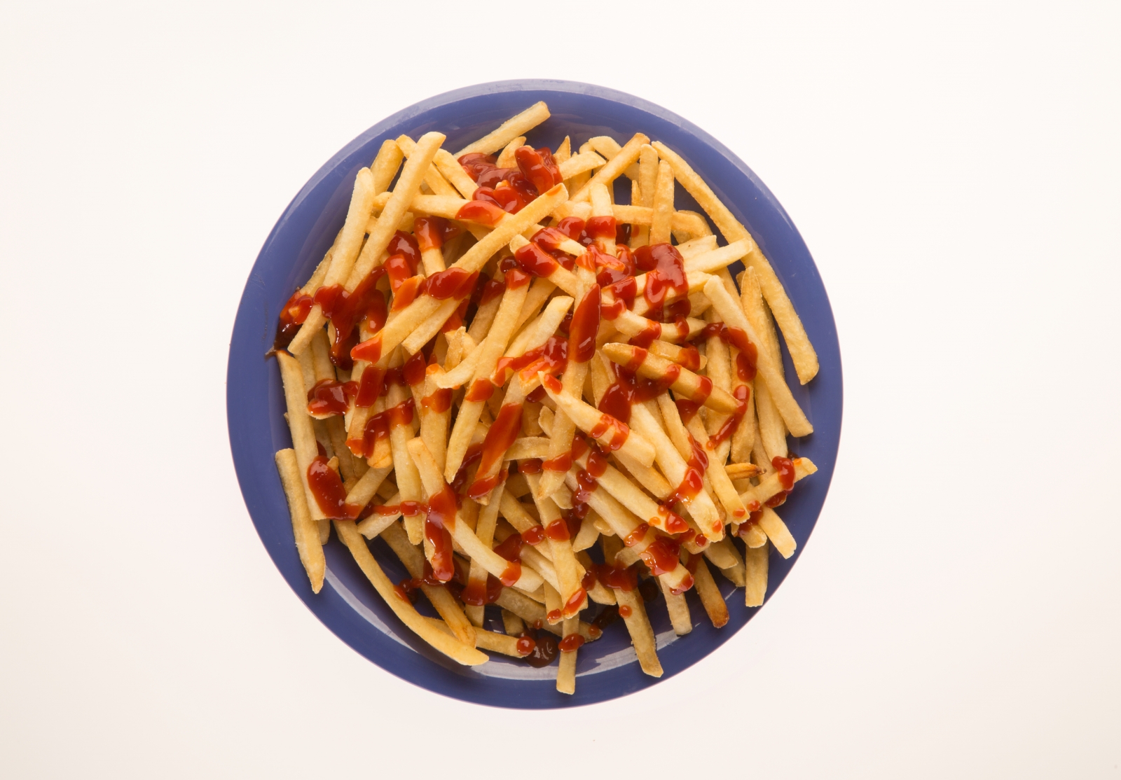a plate of french fries with ketchup
