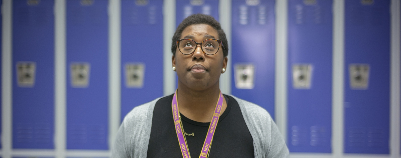 Kimberly St. Julian-Vernon in front of blue lockers