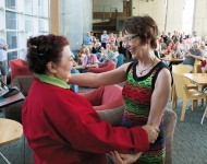 Lisa Scolaro embracing President Rebecca Chopp.