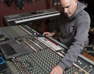 Scott Samels working at an audio mixer.