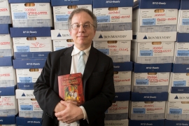 Alan Gordon ’81 holds a copy of his book