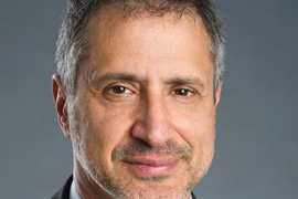 A portrait of Gustavo Schewd ’84 in a head shot.