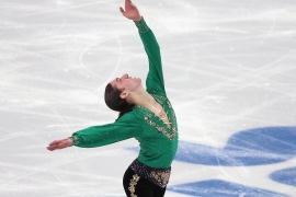 Jason Brown strikes a dramatic pose during day two of the Sochi 2014 Winter Olympics, wearing the pants Jo Lynne Johnson ’72 tailored.