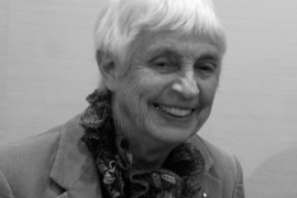 Black and white photo of a smiling Anne Fristrom