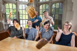 Photo of the Bulletin staff throwing toast at the camera.