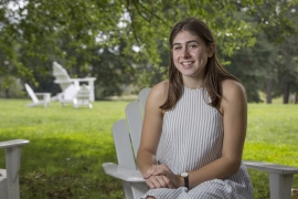 Olivia Leventhal ’18 sitting in an Adirondack chair.