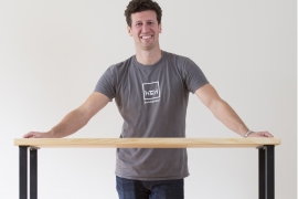 Ben Young ’09 with one of his company’s handcrafted tables.