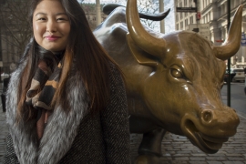 Christine Kim ’17 with the bull statue on Wall Street.