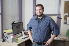 Jonathan Riggs standing in his office