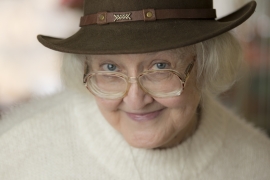 Patricia Brooks Eldridge ’60 posing in a brown fedora