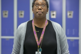 Kimberly St. Julian-Vernon in front of blue lockers