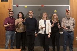 Bulletin staffers tossing apples in a classroom