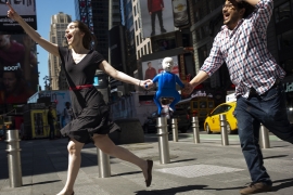 Marina Tempelsman and Nicco Aeed running through Times Square