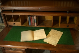 Joel Bean desk with open journals on top