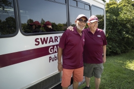 shuttle drivers in front of bus 