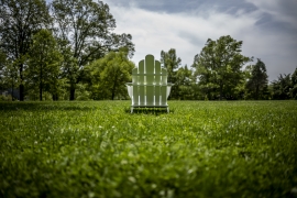 white chair outside on green grass