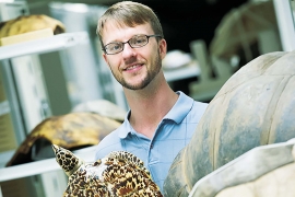  Tyler Lyson holding a Hawksbill sea turtle.