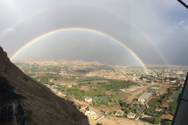 A rainbow over a valley. 