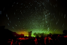 time-progression photo of star-blurred night sky