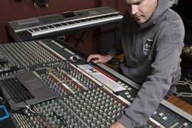 Scott Samels working at an audio mixer.