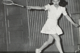 Gloria Evans Dillenbeck Dodd ’47 swinging a tennis racket.