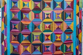 multi colored geometric pattern quilt 