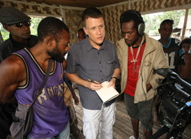 Linguist K. David Harrison (center) works with John Agid (left) of Matugar villiage, Papua New Guinea, to document Matukar Panau, an endangered Oceanic language.