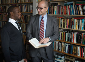 Paul Cato ’14 (left) has benefited immensely from his relationships with Mellon Mays mentors such as Anthony Foy (right), coordinator of the program.