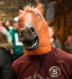 Student wearing a horse mask