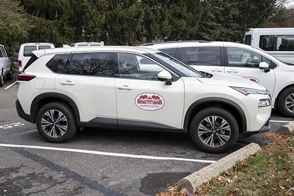 White SUV with Swarthmore College logo