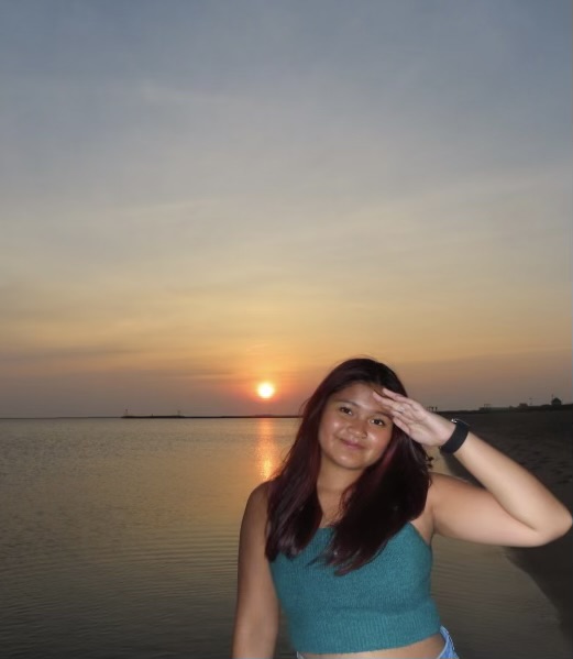 Jade Buan in front of sunset