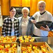  Rod ’67 and Dorothy Woods Chronister ’66 prepare food in the kitchen