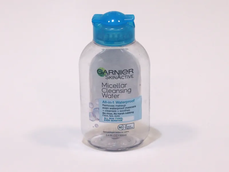 Empty plastic face cleanser bottle